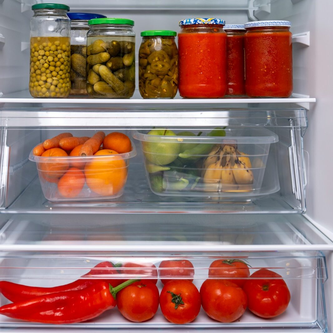 A refrigerator filled with lots of different types of food